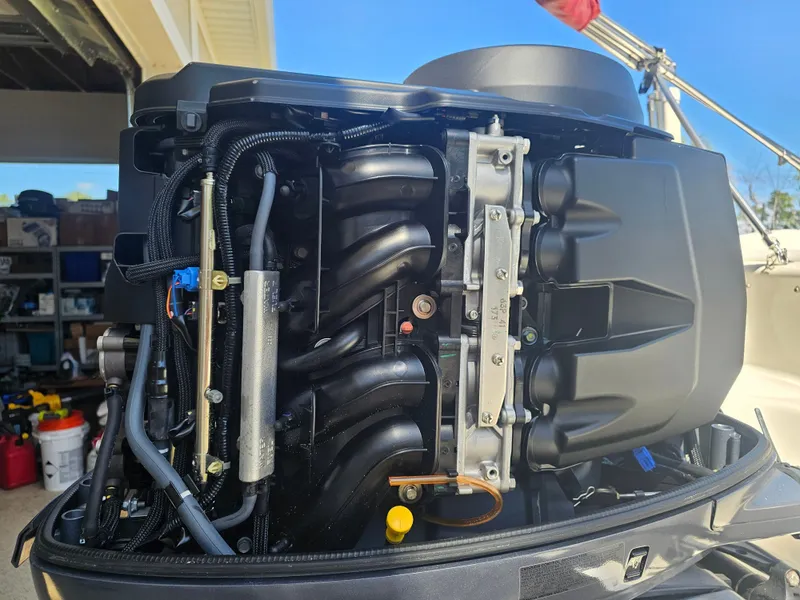 Slide: The Image of Engine of a 2012 Godfrey Hurricane 217 Sundeck boat. - 19