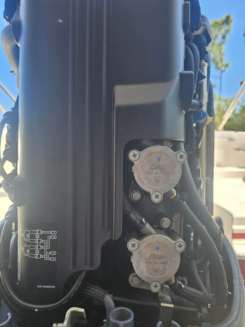 Slide: The Image of Close-up of a 2012 Godfrey Hurricane 217 Sundeck engine component. - 20