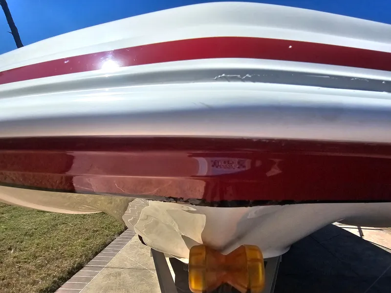 Slide: The Image of 2012 Godfrey Hurricane 217 Sundeck boat with red stripe. - 26