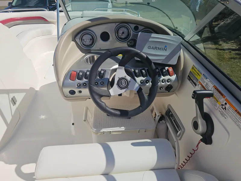 Slide: The Image of 2012 Godfrey Hurricane 217 Sundeck cockpit with Garmin navigation system. - 4