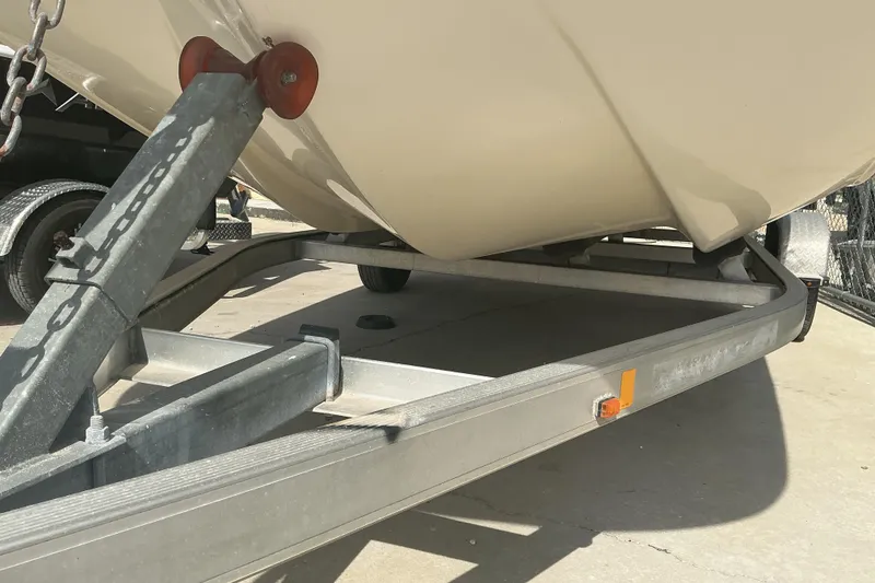 Slide: The Image of 2014 Carolina Skiff 198 DLV boat on a trailer, close-up view. - 13