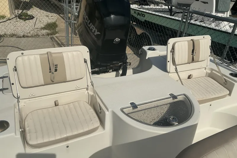 Slide: The Image of 2014 Carolina Skiff 198 DLV boat interior with seating and Mercury outboard motor. - 7
