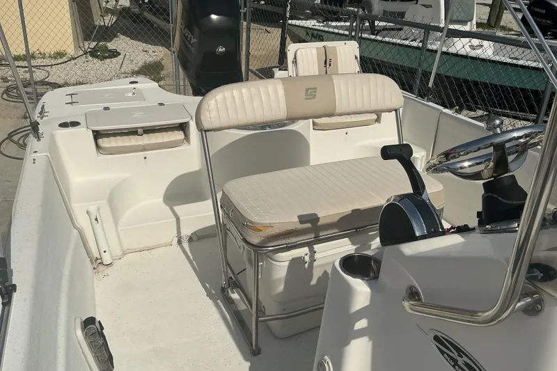 Slide: The Image of 2014 Carolina Skiff 198 DLV boat interior with seating and steering console. - 8