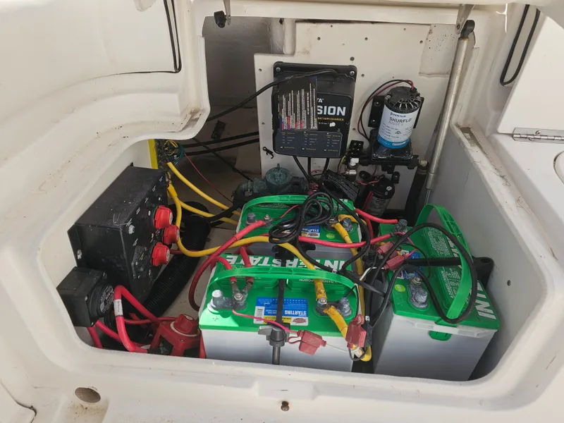 Slide: The Image of Battery compartment of a 2006 Robalo R265 Walkaround boat. - 12