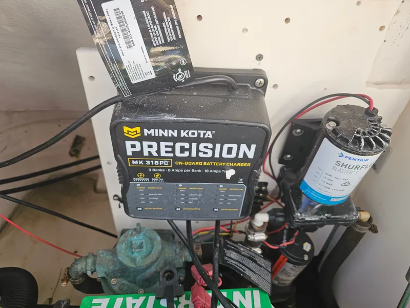 Slide: The Image of Minn Kota precision charger and Shurflo pump in Robalo R265 boat. - 13