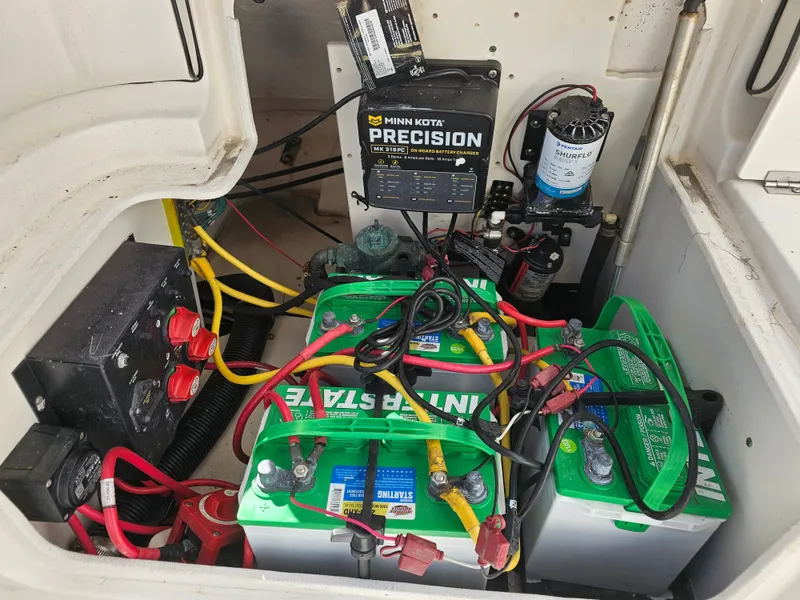 Slide: The Image of Battery compartment of 2006 Robalo R265 Walkaround boat with charger. - 14
