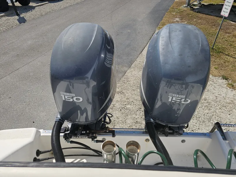 Slide: The Image of Two Yamaha 150 outboard motors on a 2006 Robalo R265 Walkaround boat. - 15
