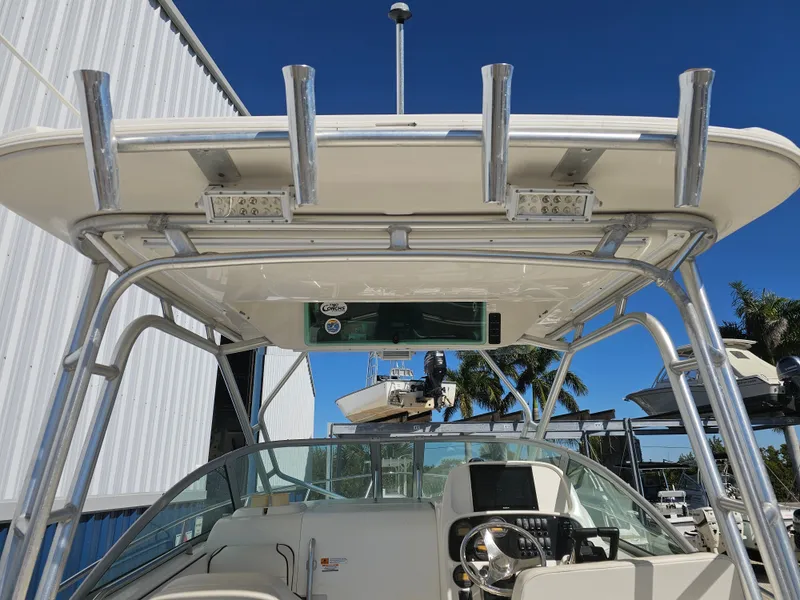 Slide: The Image of 2006 Robalo R265 Walkaround boat with helm and T-top. - 2