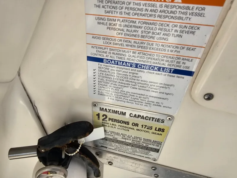 Slide: The Image of Safety and capacity instructions on a Robalo R265 boat. - 20