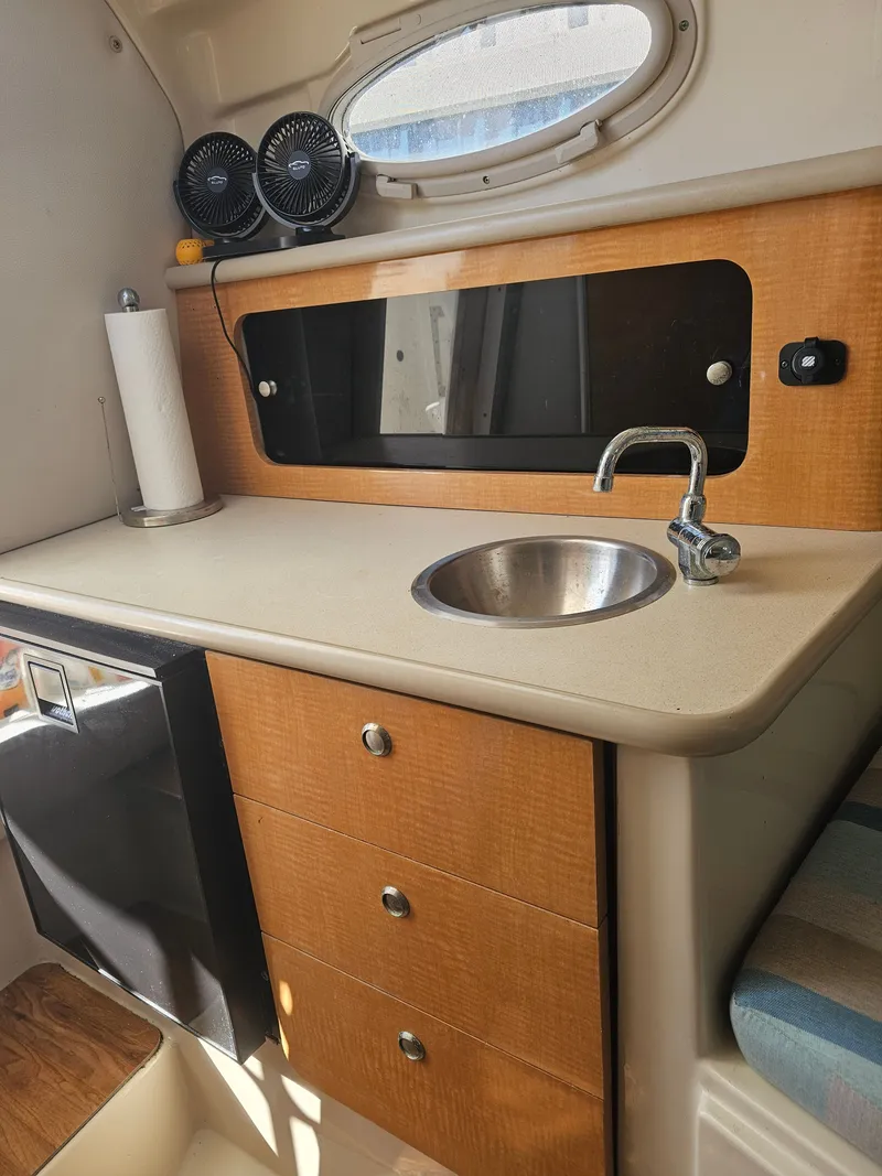 Slide: The Image of Galley area in a 2006 Robalo R265 Walkaround boat. - 22