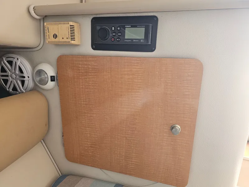 Slide: The Image of Interior of 2006 Robalo R265 Walkaround with speaker and control panel. - 23