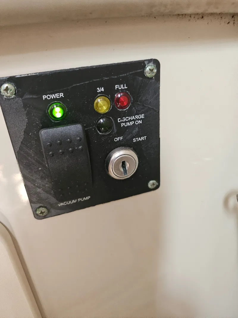 Slide: The Image of Control panel of 2006 Robalo R265 Walkaround with indicator lights. - 27