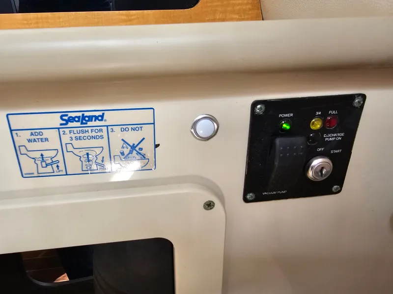 Slide: The Image of Control panel and instructions on a 2006 Robalo R265 Walkaround boat. - 28