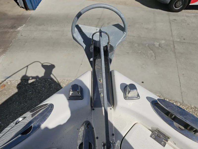 Slide: The Image of Bow of a 2006 Robalo R265 Walkaround boat with anchor. - 34