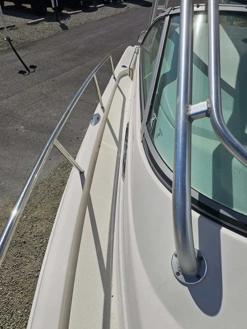 Slide: The Image of 2006 Robalo R265 Walkaround boat deck with stainless steel railing. - 37