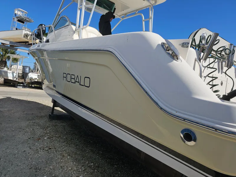 Slide: The Image of 2006 Robalo R265 Walkaround boat on a boatyard. - 40