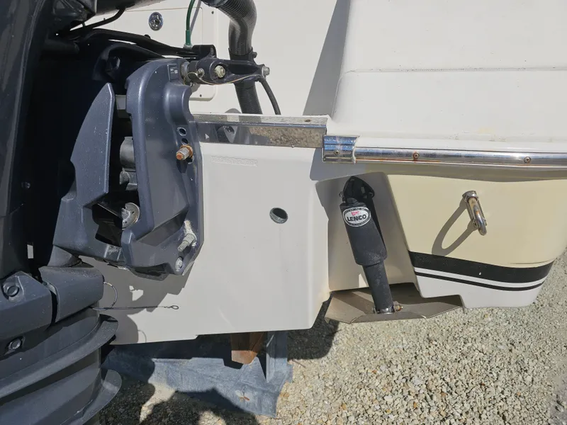 Slide: The Image of 2006 Robalo R265 Walkaround boat hull with Lenco trim tab. - 42