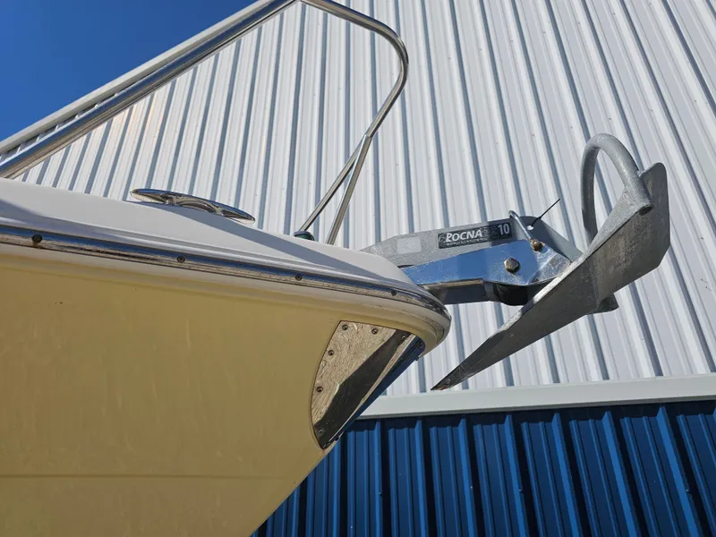 Slide: The Image of 2006 Robalo R265 Walkaround with Rocna anchor against metal building. - 44