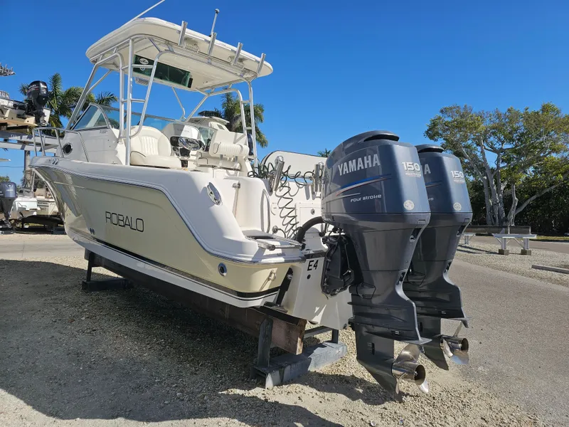 Slide: The Image of 2006 Robalo R265 Walkaround with Yamaha engines outdoors. - 48