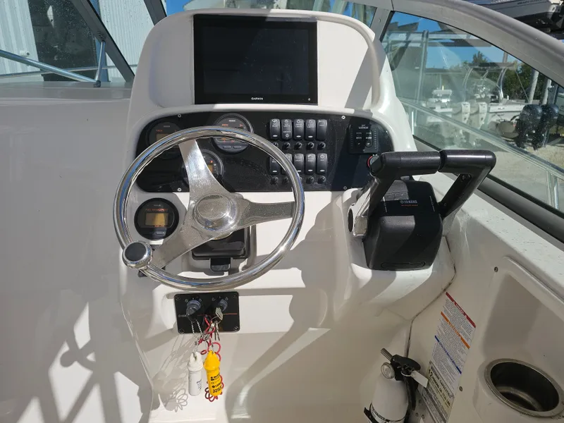 Slide: The Image of Helm console of a 2006 Robalo R265 Walkaround boat. - 5