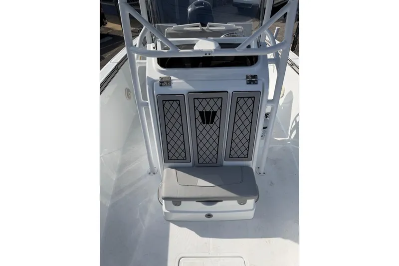 Slide: The Image of 2021 Wellcraft 202 Fisherman boat interior with storage compartments and seating. - 13