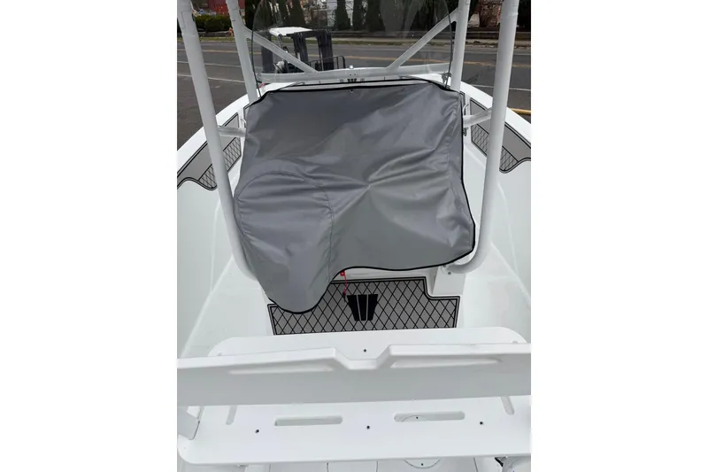 Slide: The Image of 2021 Wellcraft 202 Fisherman boat interior with covered console and seating area. - 18