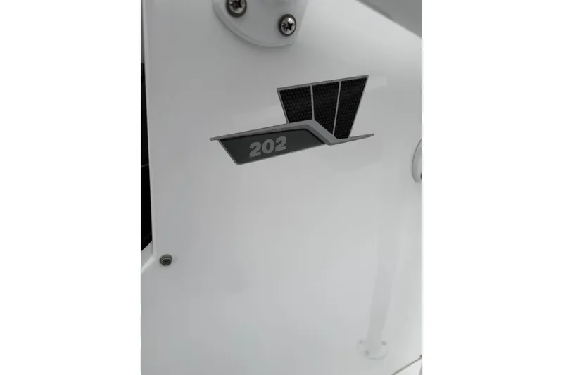 Slide: The Image of Close-up of 2021 Wellcraft 202 Fisherman boat emblem on white surface. - 22