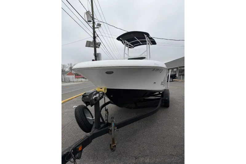 Slide: The Image of 2021 Wellcraft 202 Fisherman boat on trailer, parked on street. - 3