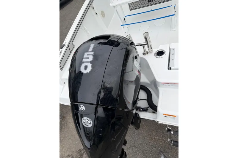 Slide: The Image of 2021 Wellcraft 202 Fisherman boat with a 150 HP Mercury outboard motor. - 4