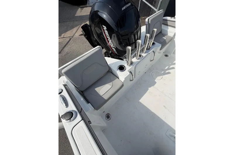 Slide: The Image of 2021 Wellcraft 202 Fisherman boat interior with seating and Mercury engine. - 5