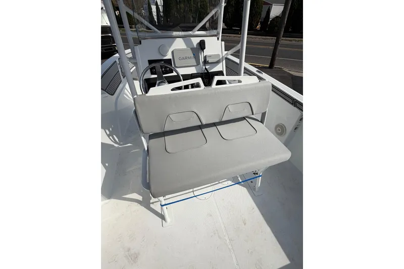 Slide: The Image of 2021 Wellcraft 202 Fisherman boat interior with gray seating and Garmin navigation system. - 6