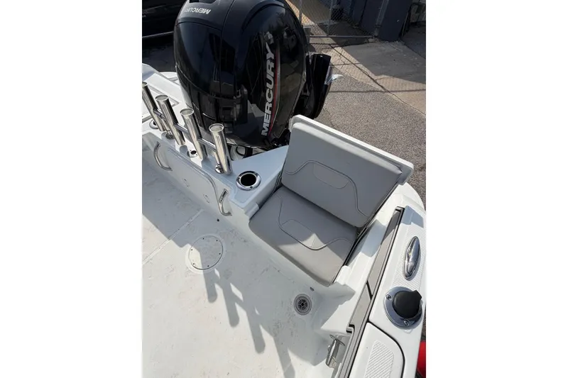 Slide: The Image of 2021 Wellcraft 202 Fisherman boat with Mercury engine and seating area. - 7