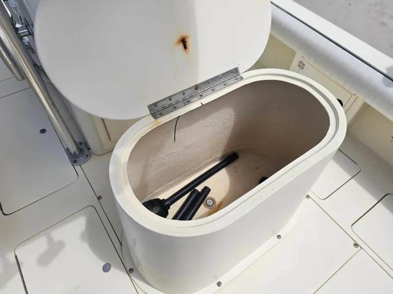 Slide: The Image of Open storage compartment on a 2000 Dorado 23 boat. - 10