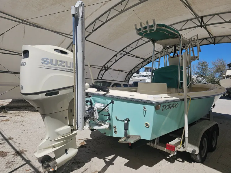 Slide: The Image of 2000 Dorado 23 boat with Suzuki outboard motor. - 11