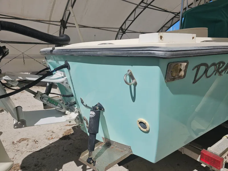 Slide: The Image of Rear view of a 2000 Dorado 23 boat on a trailer. - 12