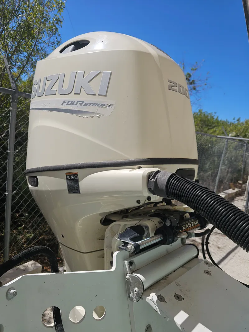 Slide: The Image of Suzuki 200 HP outboard motor on a 2000 Dorado 23 boat. - 14