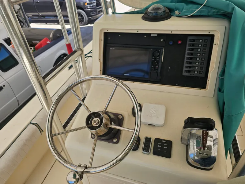 Slide: The Image of Helm console of a 2000 Dorado 23 boat with Garmin navigation system. - 17