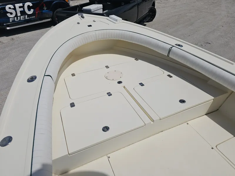 Slide: The Image of 2000 Dorado 23 boat with storage compartments and seating. - 2