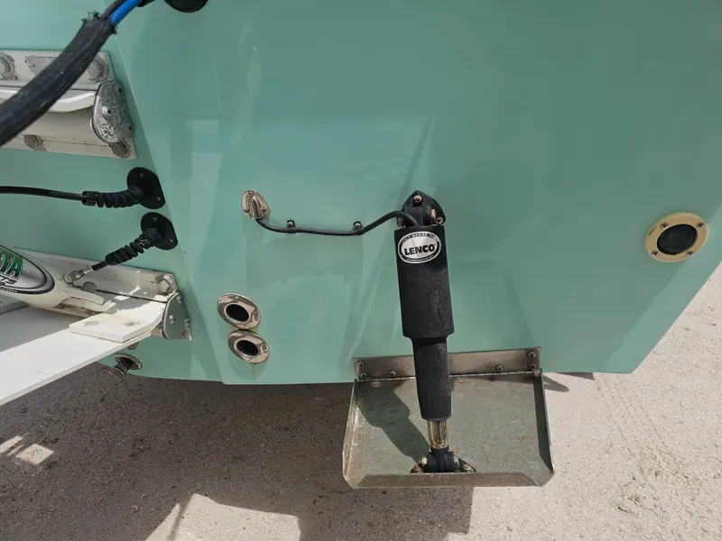 Slide: The Image of Rear view of a 2000 Dorado 23 boat with Lenco trim tab. - 23