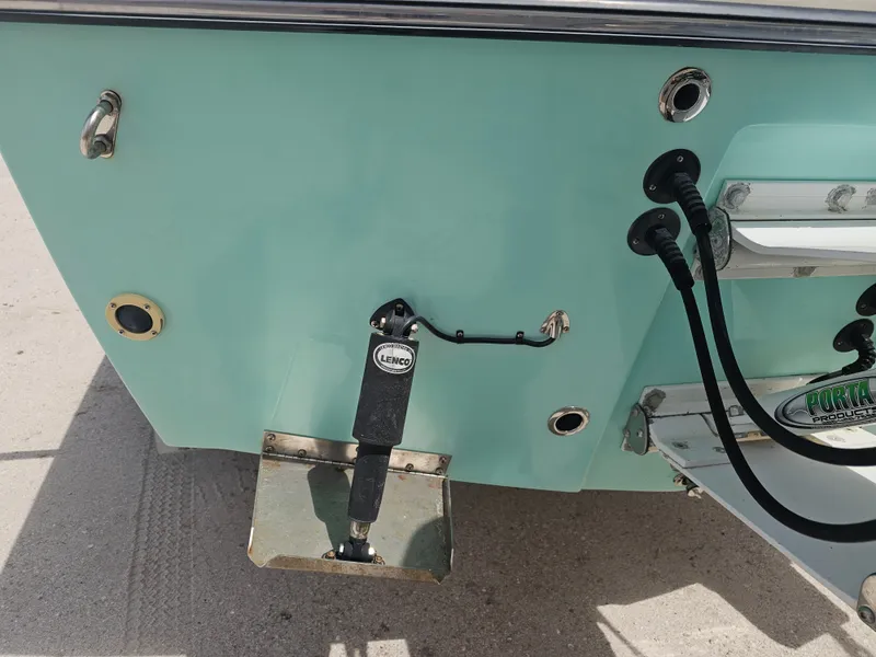 Slide: The Image of Rear view of a 2000 Dorado 23 boat with Lenco trim tab. - 27
