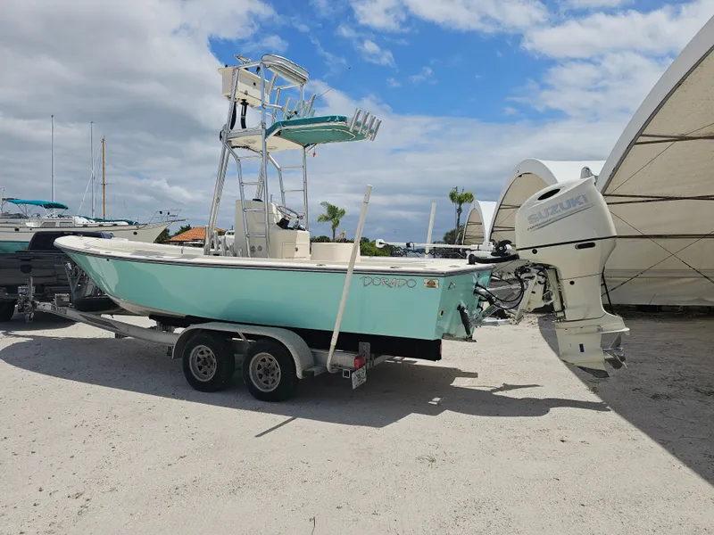 Slide: The Image of 2000 Dorado 23 boat with Suzuki outboard motor on trailer. - 30
