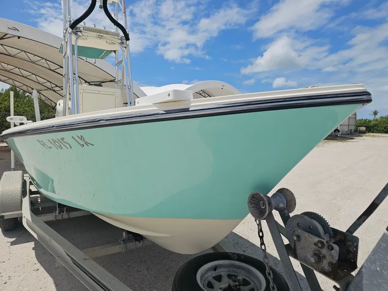 Slide: The Image of 2000 Dorado 23 boat on trailer under blue sky. - 32