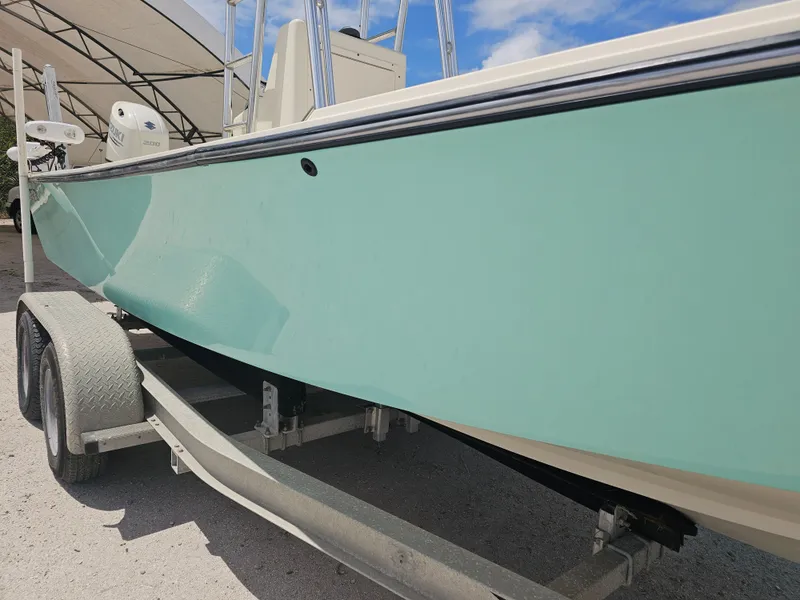 Slide: The Image of 2000 Dorado 23 boat on trailer, side view. - 34