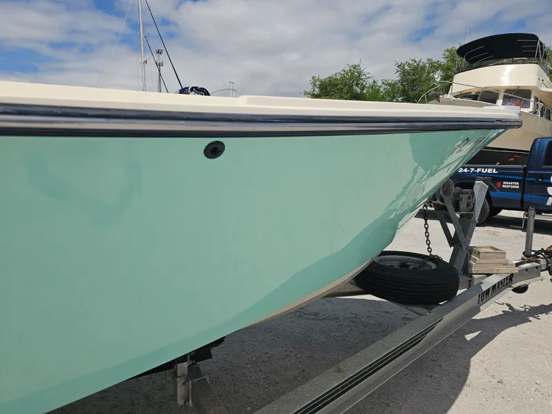 Slide: The Image of 2000 Dorado 23 boat on trailer, side view. - 35