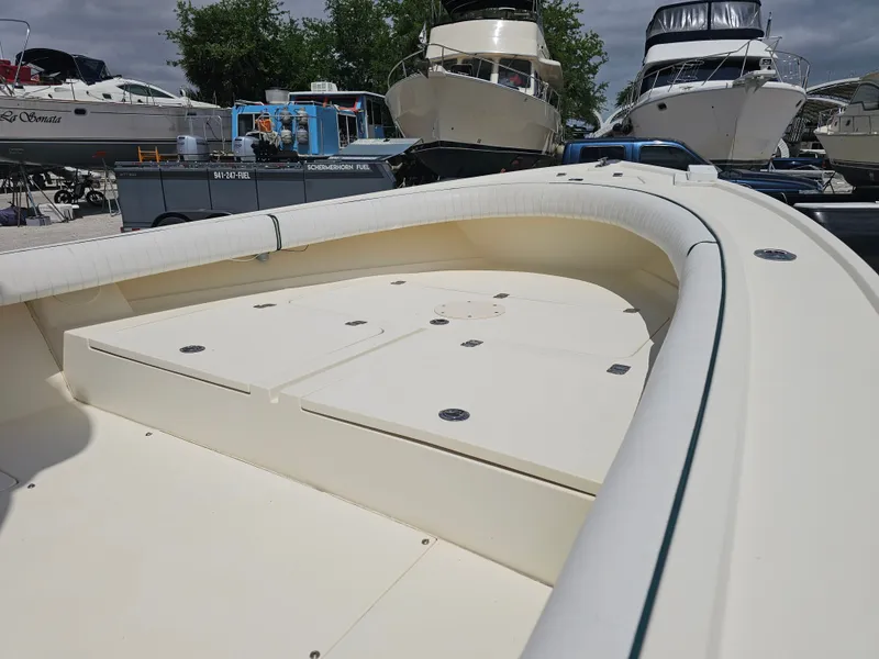 Slide: The Image of 2000 Dorado 23 boat docked among other yachts. - 36