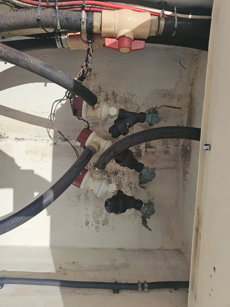 Slide: The Image of Hoses and valves in the engine compartment of a 2000 Dorado 23. - 42