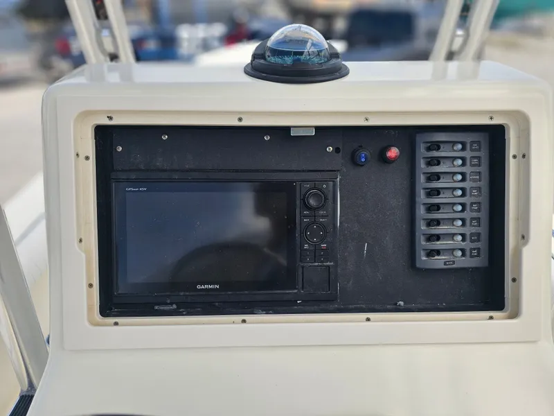 Slide: The Image of Dorado 23 boat console with Garmin GPS and switch panel, year 2000. - 44