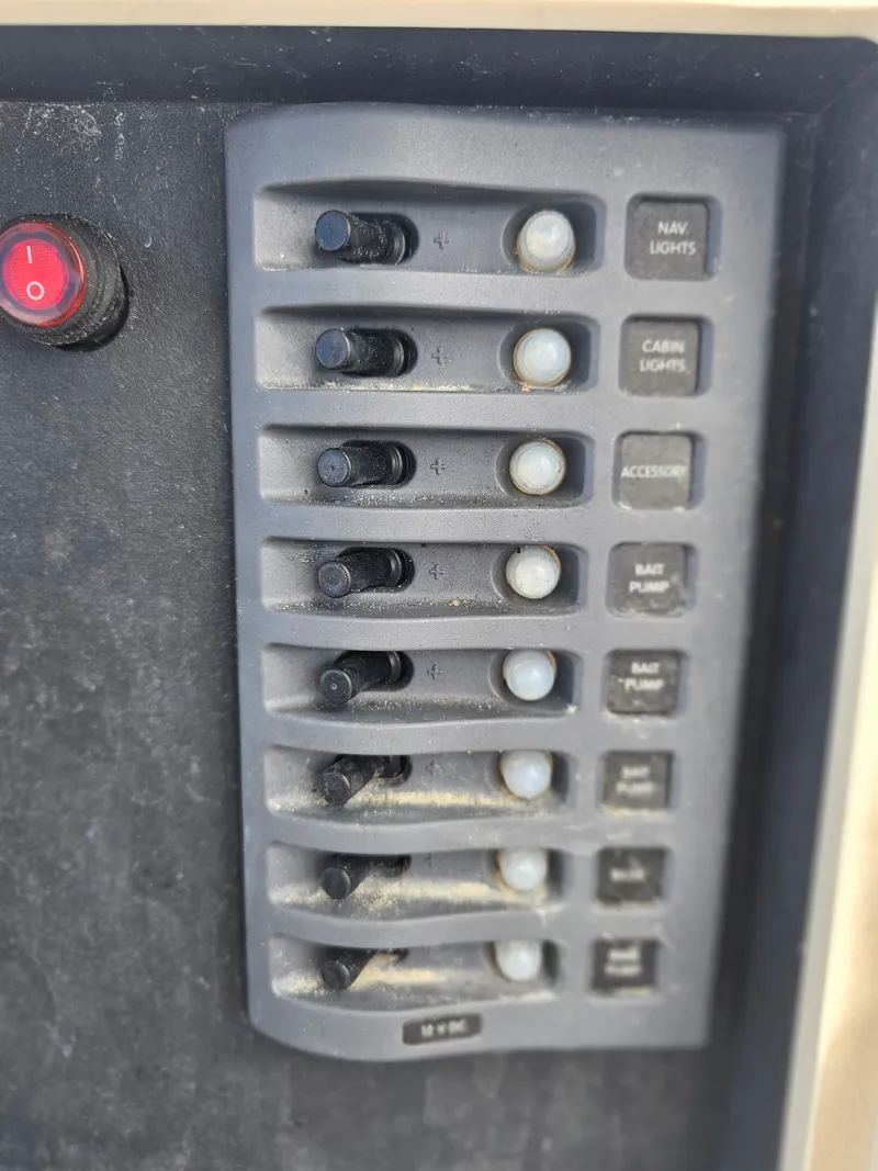 Slide: The Image of Boat control panel with switches, Dorado 23, 2000 model. - 46