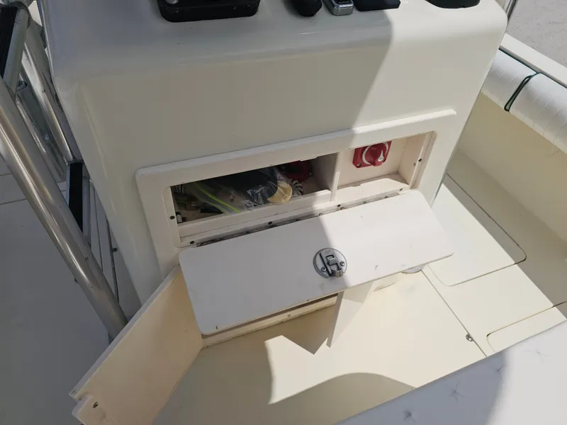 Slide: The Image of Open storage compartment on a 2000 Dorado 23 boat. - 49