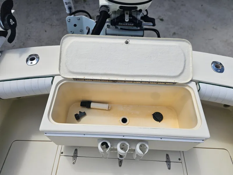 Slide: The Image of Open storage compartment on a 2000 Dorado 23 boat. - 5